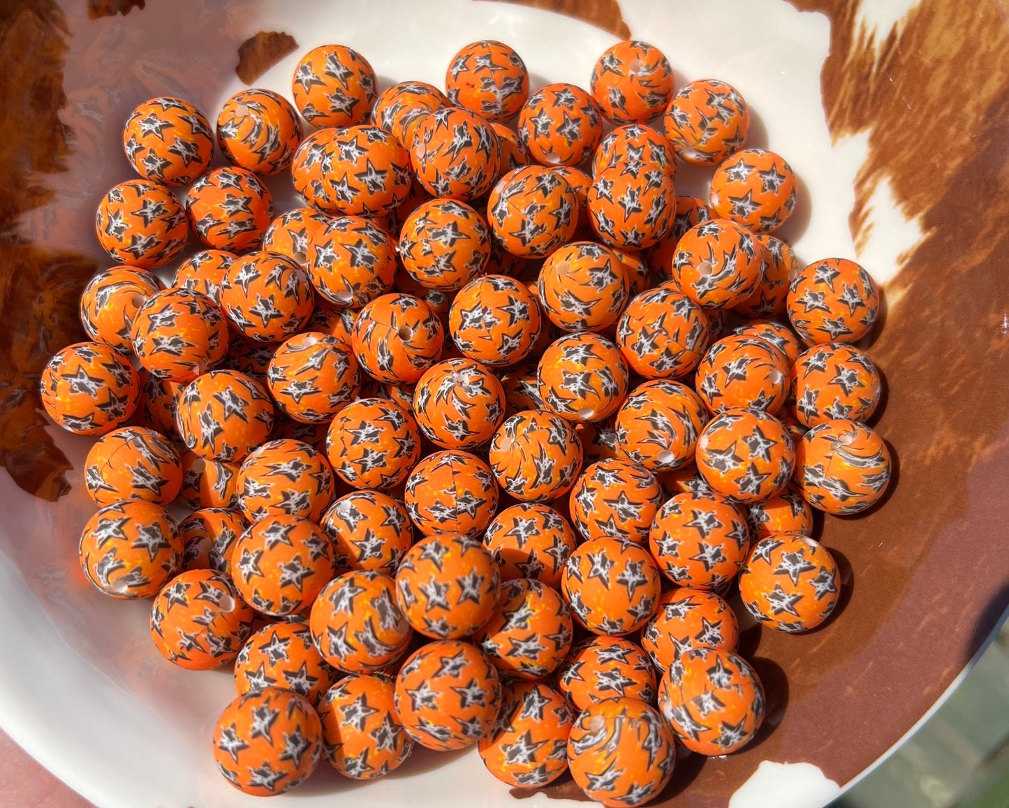 15mm Orange cow print star beads (pack of 5)